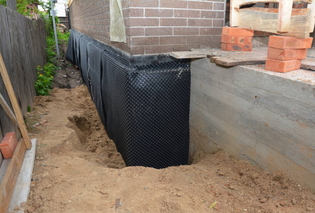 SJ Waterproofing Pros technician performing targeted Sump Pump Installation assessment in Saint Bonifacius, MN